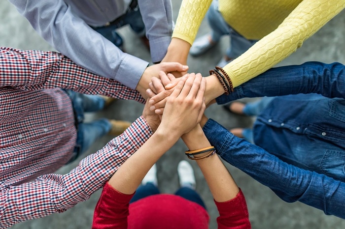 What are the benefits of team building for a company?